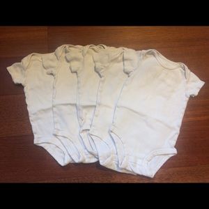 6 Carter’s white onesies